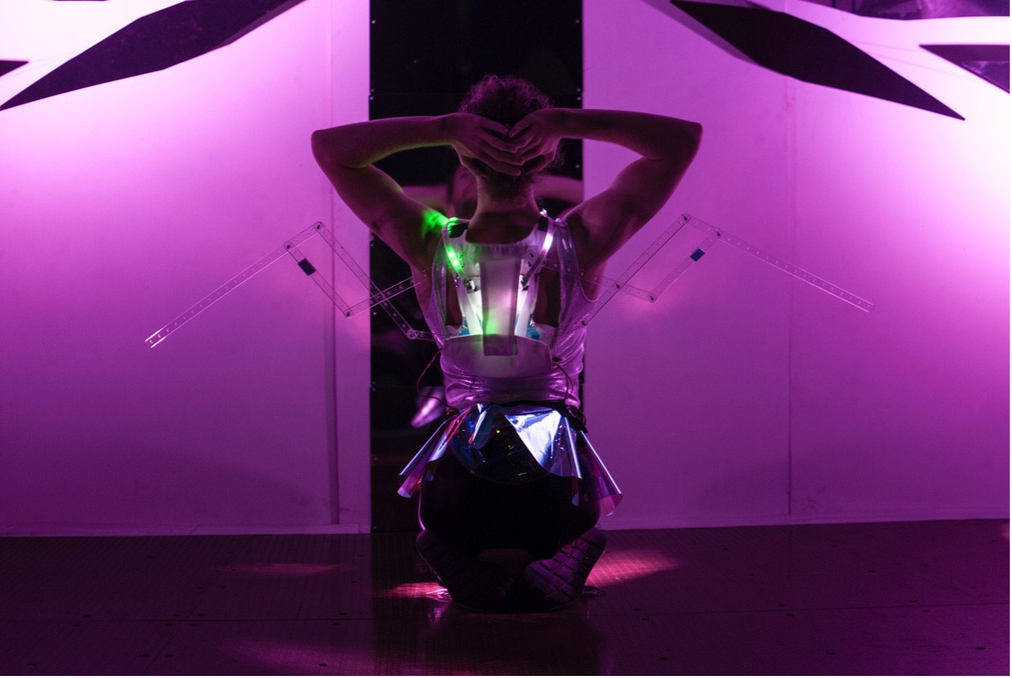 Babyface by Kate Ladenheim x The RAD Lab.  Presented at the Performance Arcade in Wellington, NZ in February 2020.  Performer Sebastian Geilings of Footnote New Zealand Dance, wearing a pair of breath-activated robotic wings.  Photo by Colin Edson.